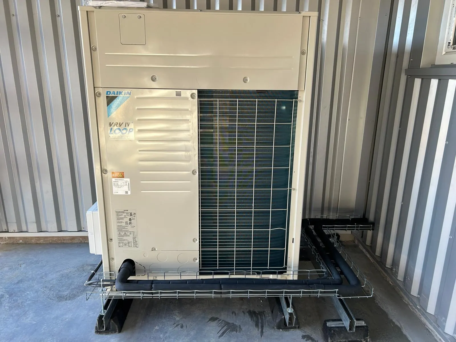 Outdoor air conditioning unit installed on a base