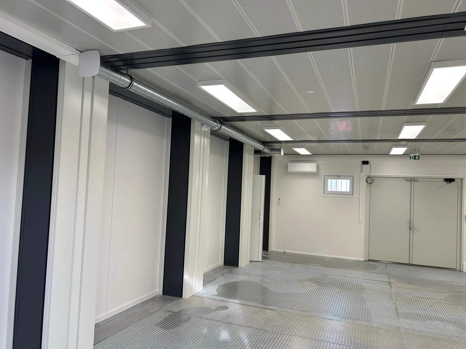 Interior corridor with freshly finished walls and ceiling