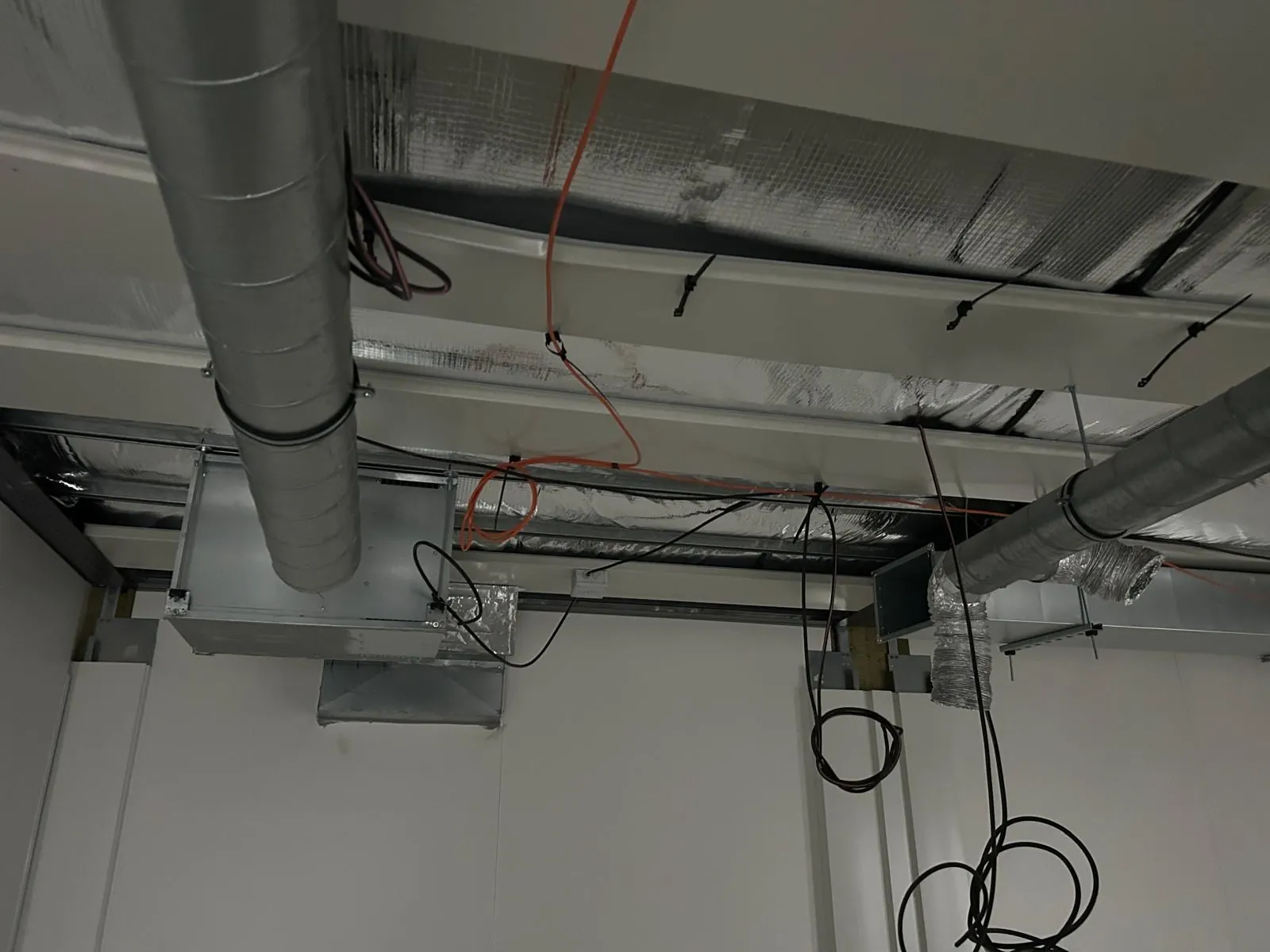 Ventilation ductwork run installed in a technical ceiling